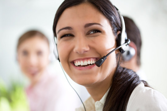 Happy woman in a call center