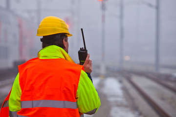 worker with orange jacket