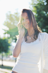 young woman talk by cellphone on street