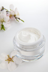 Face cream and almond flowers