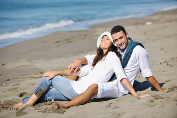 Fototapeta premium happy young couple have fun at beautiful beach