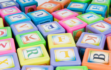 Learning and education concept - pile of alphabet blocks