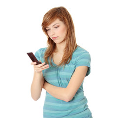 Fototapeta premium Teen girl using cell phone