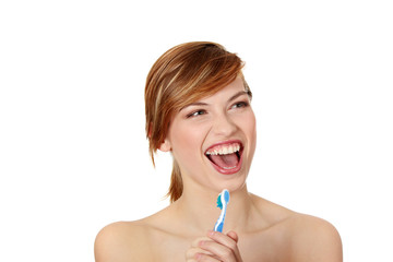 Young woman singing to tooth brush