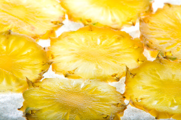 Cut pineapple isolated on white background