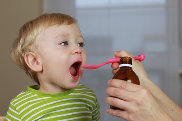 2 years old baby boy and medicine, cough syrup