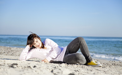 Portrait of brunette girl at the beach.