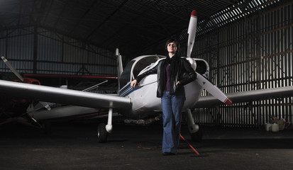 young woman with private airplane