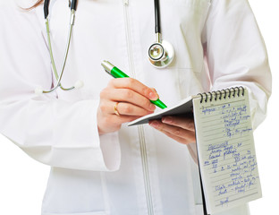 Young doctor writes something
