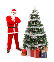 Santa Claus standing near Christmas tree