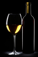 White wine bottle and glass silhouette over black background