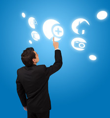 business man pressing touchscreen button