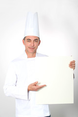 Closeup of chef showing white board