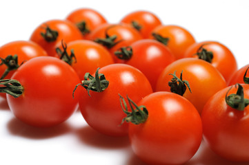 many Beautiful red cherry tomato isolated on white background