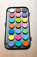 Art concept with painters palette and paint brush