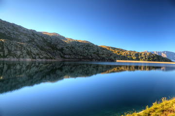 Fototapeta na wymiar calm mountain lake at sunrise