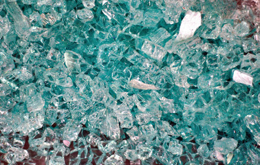 Shattered glass on a gray floor as background