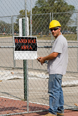 Worker Posting Sign