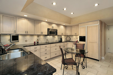 Kitchen with light oak cabinetry