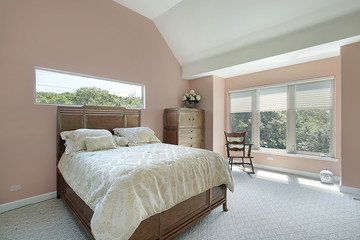 Master bedroom with mauve colored walls