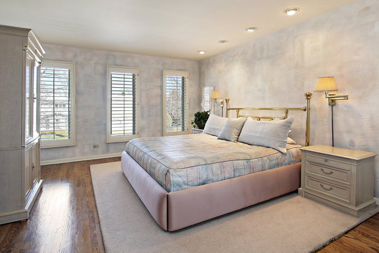 Master bedroom with wood floors