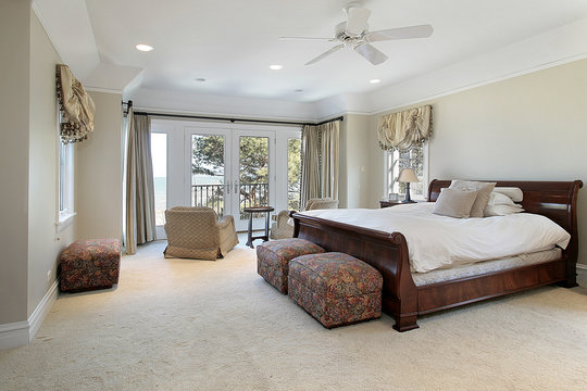 Luxury master bedroom with lake view