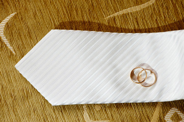 Wedding rings on a white tie