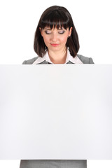 Naklejka premium business woman behind a white paper