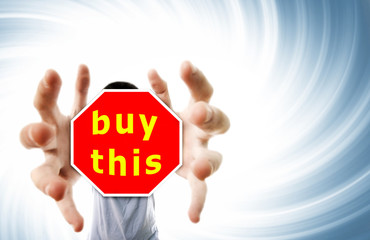 Man grabing a red sign.