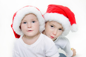 two cute santa helpers over white