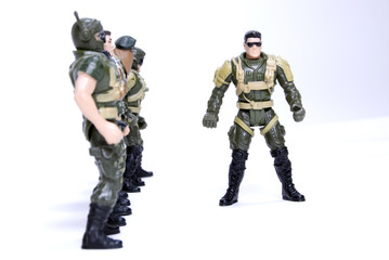 toy soldiers in camouflage   over white background