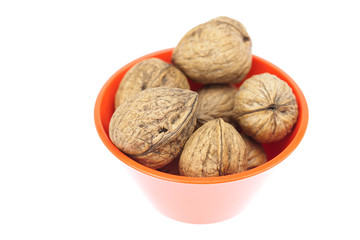 walnuts in a bowl isolated on white