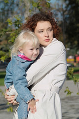 Fototapeta premium Portrait of the little girl and mum