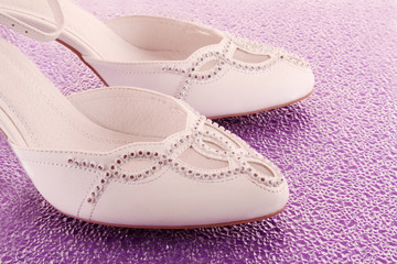 Obraz na płótnie Canvas Closeup of fashionable bridal wedding shoes