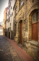Naklejka na ściany i meble Empty street in the old center, Riga, Latvia