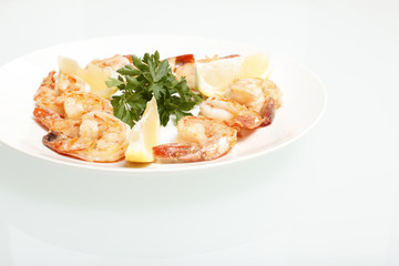 Grilled shrimp on a plate.