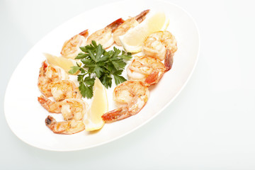 Grilled shrimp on a plate.