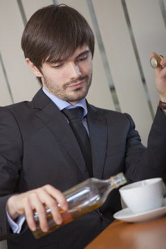 man drinking by office work