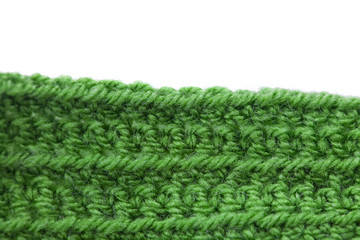 Skein of wool  and knitted piece isolated on white