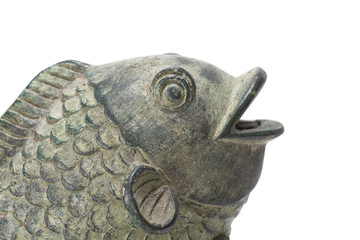 Asian style metal ornamental koi fish on a white background