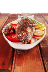 main course: whole fryed sunfish on wood