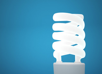 Energy-Saving Light Bulb on blue background