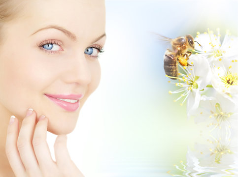 girl's face and plum flowers with a bee