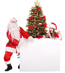 Santa claus and girl by christmas tree and banner.