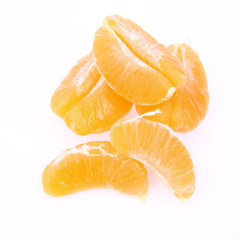 Segments of a peeled mandarin on white background