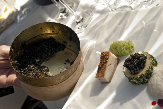 different sorts of caviar on a white plate
