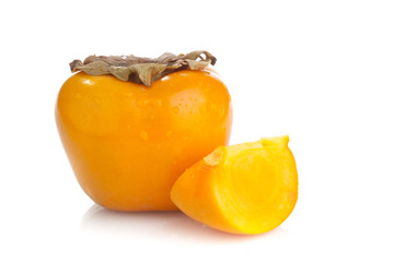 Two perfect persimmon fruits on white background