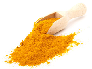 turmeric over the spoon,  isolated on white background