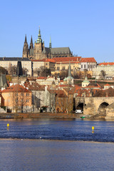 View on the autumn Prague gothic Castle with the Charles Bridge