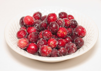 Sugared cranberries in white china with clipping path